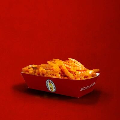 Dave’s Hot Chicken cheese fries topped with warm cheese sauce