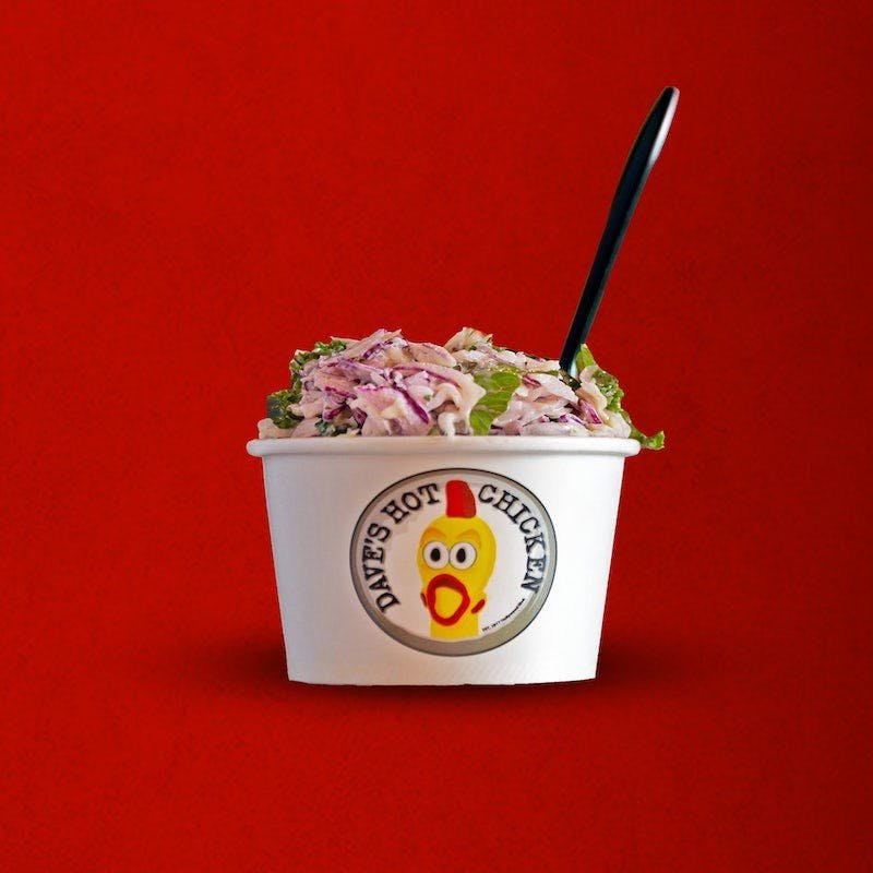 Dave’s Hot Chicken kale slaw in a branded side cup