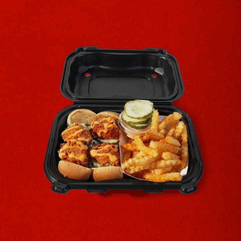 Four Dave’s Hot Chicken mini sliders served with crinkle-cut fries